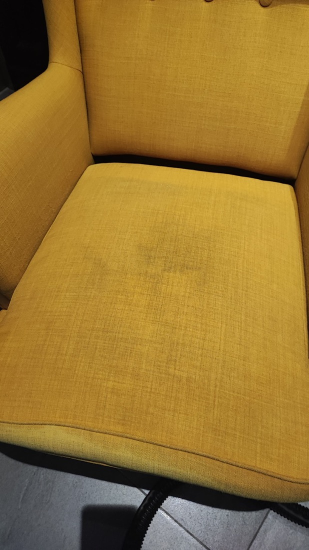 Stained armchair before Oassist cleaning