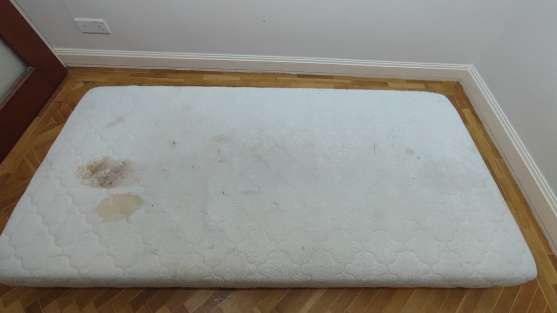 Mattress with stains before treatment